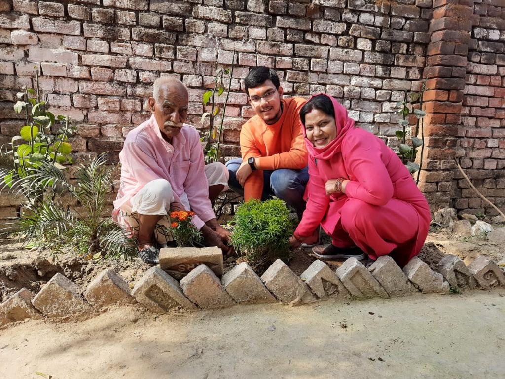 planting a sapling with family